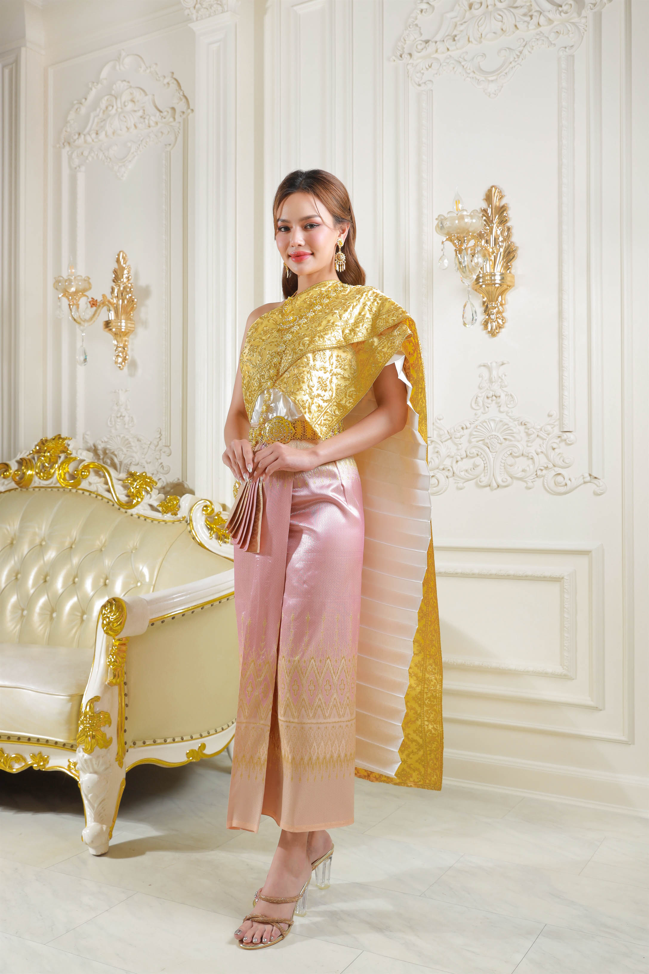 Thailand's national costume in pink and gold