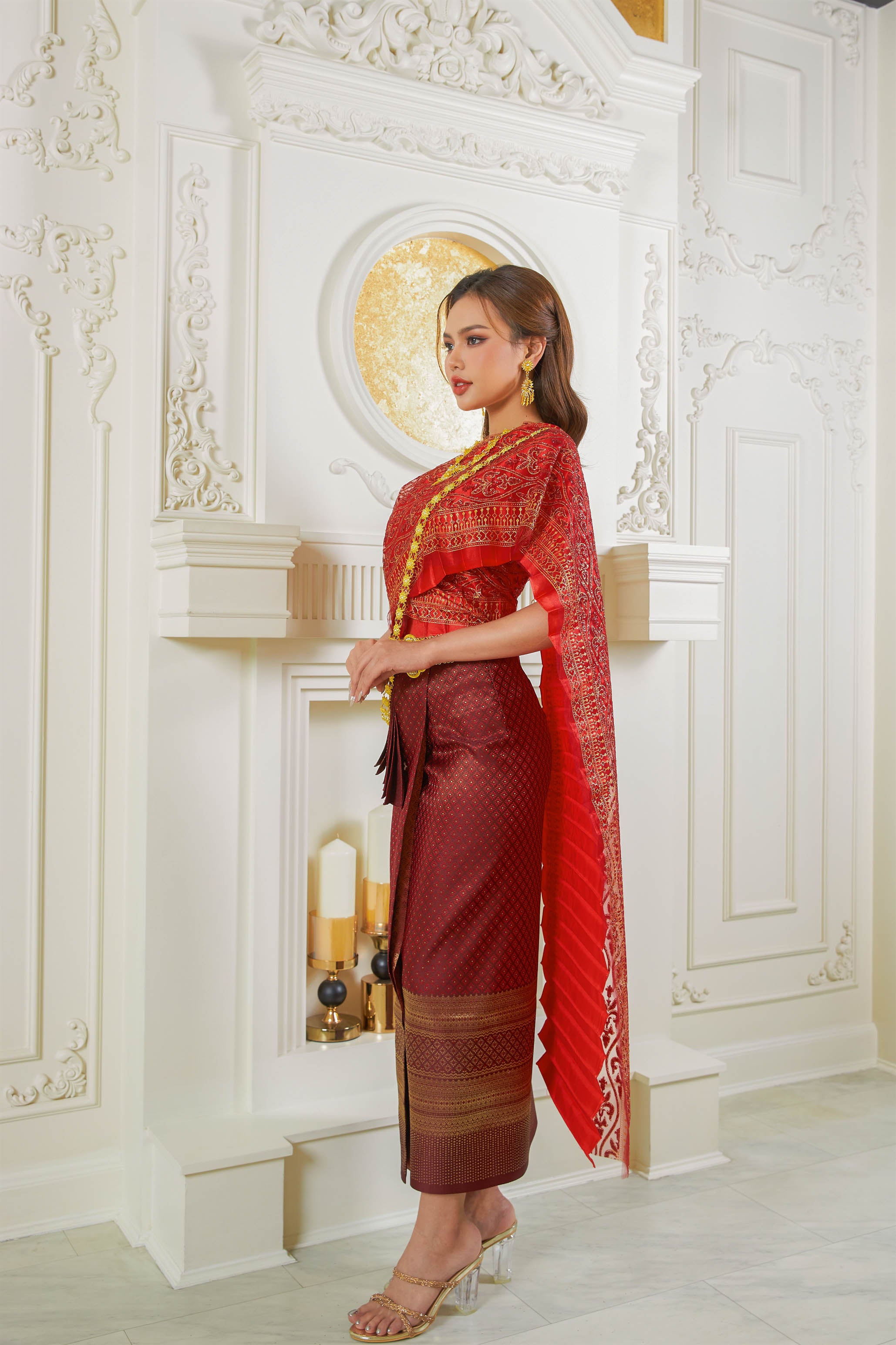 Thailand's national dress in red and gold